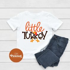 "This cute kids shirt has a little turkey design that is printed directly onto the shirt using a commercial Direct to Garment printer.  It is the perfect shirt to celebrate Thanksgiving. Little Turkey Kids Shirt - Thanksgiving Toddler Shirt - Cute Fall Shirt - Fall Toddler Shirt - Thanksgiving Shirt ► SHIRT DETAILS: ☆ We use 100% cotton shirts and bodysuits ☆ Short Sleeve Shirts ☆ Shirts and bodysuits run true to size ☆ Design is printed directly to the shirt using a commercial Direct to Garment printer that uses kid safe inks that are water-based and non-toxic. HOW TO ORDER: - Select your size from the drop down menu - For personalized items add your child's name to the \"Add your personalization\" field. - Add to cart - Select your shipping from the drop down menu. - Enter any additional Small Turkey, Thanksgiving Toddler, Thankful Turkey, Cute Fall Shirt, Thanksgiving Tee, Thanksgiving Baby, Turkey Shirts, Toddler Fall, Thanksgiving Kids