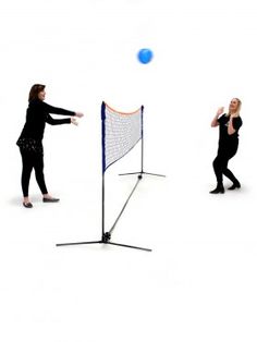 two people are playing with a ball in the air and one person is throwing it