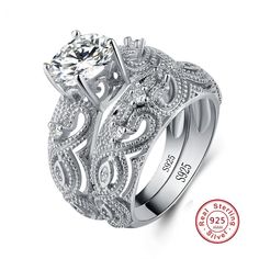 a white gold engagement ring set with an intricate design