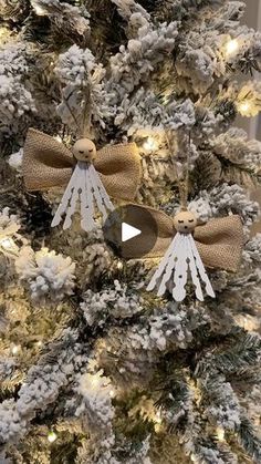 a christmas tree decorated with white and gold bows