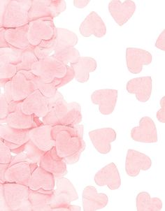 pink hearts are scattered on a white background