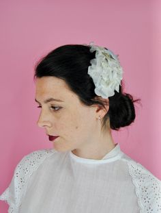 A lovely light blue and off-white floral headpiece - a great summer wedding accessory. It features a light powder blue velvet bow atop, with flowers in a variety of fabrics throughout. The piece is more like a headpiece, almost a head band, as the frame can be pulled  to make it slightly larger (very much like a headband). You may need to pin this to keep it on ones head securely. There is a tag, though it seems tucked into the frame, but it looks to read "Made in Japan".  FREE SHIPPING! Measure White Headband For Garden Party, White Flower Headpiece For Garden Party, White Flower Headpieces For Garden Party, White Spring Wedding Headband, Cream Flower Headband For Wedding, White Handmade Flowers Headband For Spring, Flower Shaped White Headband For Weddings, White Hair Accessories For Spring Wedding, White Handmade Flowers Headband