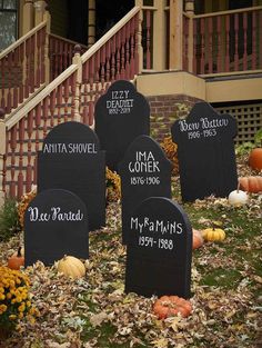 four tombstones with names on them in front of a set of stairs and steps