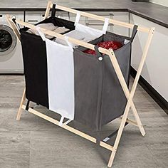 a laundry hamper sitting on top of a kitchen floor