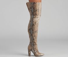 Set the chic standard in boots that elevate your outfit. The boots feature a faux snake print. an inner zipper closure. a pointy toe. block heel. The boots are composed of a faux leather material. Complete look with a cardigan and mini skirt. Fit & Features Faux snake print Thigh-high fit Inner zipper closure Pointy toe Block heel Faux leather material Runs true to size Snake Boots, Occasion Shoes, Rhinestone Dress, Children Shoes, Embellished Dress, Boots For Sale, The Chic, Snake Print, Ladies Day