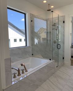 a bathroom with a large tub and walk in shower