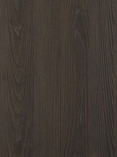 a close up view of the wood grains on this dark brown wall paneling