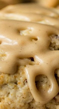 a close up view of some food with gravy on it's surface