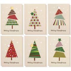 four christmas cards with different trees on them