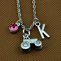 "Details Color:silver Material: Metal Zinc Alloy (Lead Free, Nickel Free) Tractor Size:16X16mm Antique silver chain with lobster clasp 20\" Birthstone: please choose Jan=Ruby; Feb=Amethyst; Mar=Aqua blue; Apr=Clear; May=Emerald; June=Pink; July=Ruby red; Aug=Peridot; Sep=Sapphire; Oct=Rose; Nov=Topaz; Dec=Peacock blue All our items are NICKEL FREE and LEAD FREE. If you need more quantity, please do not hesitate to contact me. * * * * *FEEDBACK * * * * * Dear buyers, we appreciate your business, Silver Metal Charm Necklace For Birthday, Silver Charm Necklaces With Adjustable Chain For Birthday, I Can Do Hard Things, May Emerald, Do Hard Things, Pin Enamel, Gifts For Farmers, Tassel Keychain, Heart Shape Pendant