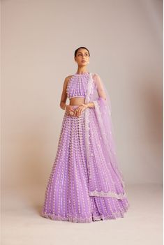 Embrace the Ethnically Modern Styles with this Lavender Set from Vvani by Vani Vats. Made From High quality Georgette, it features hook and eye closure and Embleshied pattern along with Sleeveless & halter neck design. Pair it with flats or heels & earrings to elevate your Style.  Note: This Post Contains Affiliate Links.  #lehangacholi #fashion #indianfashion #sangeetoutfit #indianweddingwear #bridalfashion #affiliatelink Pearl Lehenga, Cancan Lehenga, Pearl Chandelier, Padded Blouse, Net Lehenga, Backless Crop Top