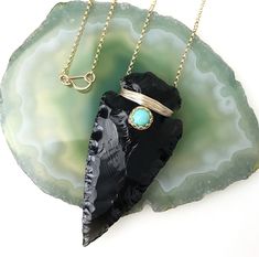 "Beautiful natural Turquoise adorns a hand-knapped Obsidian arrowhead wrapped in your choice of precious metal. This is a one of a kind design as each arrowhead and turquoise are unique. Some arrowheads are mostly opaque and others partially translucent. The pendant is suspended from a rolo chain in the precious metal of your choice and finished with a locking handmade hook clasp. The natural turquoise measures 6mm and each one is hand selected. All components are comprised of 14k gold fill or s Sagittarius And Scorpio, December Sagittarius, Scorpio Birthstone, Obsidian Arrowhead, Arrowhead Necklace, Open Bangle, Hook Clasp, Genuine Turquoise, Rolo Chain