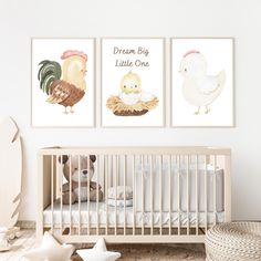 a baby's room with two pictures on the wall and a crib next to it