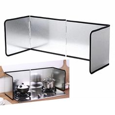 a kitchen scene with focus on the stove top and side panels that have been folded open