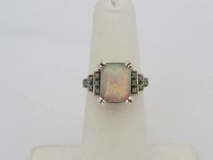 Vintage Sterling Silver White Opal Engagement Ring...Marked 925...Total of weights 3.1grams... Size 9...Measure of Face 11.5MM...It's in good condition. Silver Opal Ring For Collectors, Vintage Silver Multi-stone Opal Ring, Classic Silver Opal Ring With Multi-stone, White Gold Opal Ring Stamped 925 For Formal Occasions, Formal Silver Opal Ring With Center Stone, White Opal Engagement Ring, Engagement Ring Size, Opal Engagement Ring, Engagement Rings Opal