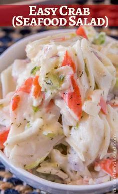 a white bowl filled with pasta salad on top of a blue and white table cloth