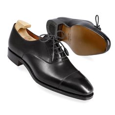 WOMEN'S OXFORDS IN BLACK VITELLO Cap Toe Oxfords With Rubber Heel Cap For Galas, Classic Oxford Shoes With Leather Sole, Classic Lace-up Shoes With Round Toe For Galas, Classic Cap Toe Oxfords For Galas, Classic Cap Toe Lace-up Shoes For Galas, Classic Oxfords With Rubber Sole For Galas, Black Cap Toe Oxfords With Leather Sole, Timeless Black Oxfords With Round Toe, Classic Black Lace-up Oxfords