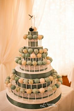 a three tiered cake with green and white decorations