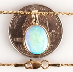 14k Yellow Gold Oval Cabochon Opal Solitaire Pendant W/ 24" Chain 2.70ct 6.93g Metal Information: 14k Yellow Gold Total Weight: 6.93g Chain Width: 1.2 MM Chain Length: 24 IN Pendant Dimensions: 19.8 x 11.6mm Stone Information Main StoneGem Type: Opal Shape: Oval Cabochon (13 x 10.5mm) Color: Multi-Color Clarity/Quality: AA Carat Weight: 2.7ct Number of Stones: 1 Total estimated ctw (carat total weight): 2.7ctw Estimated Retail Price: $4615.00 OUR PRICE: $3690.00 44260 Oval Opal Necklace With Polished Finish, Oval Fine Jewelry With High Luster, High Luster Oval Fine Jewelry, Oval 14k Gold Jewelry With High Luster, Oval 14k Gold High Luster Jewelry, Oval Yellow Gold Jewelry With High Luster, Oval Yellow Gold High Luster Jewelry, Jewelry Website, Solitaire Pendant