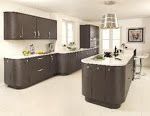 a modern kitchen with white counter tops and brown cabinets, along with stainless steel appliances