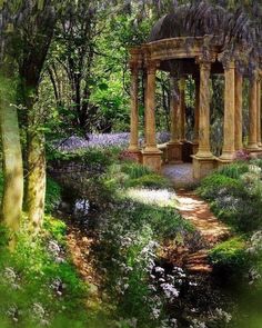 the gazebo is surrounded by trees and flowers