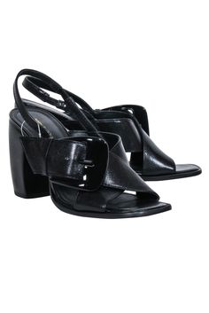 These Tory Burch heels are the perfect combination of chic and playful, with sleek leather and bold crisscross straps. The slingback style features a chunky stacked banana heel and an oversized buckle, adding a touch of quirkiness. Step out in style with these polished pumps! Size 8 Leather upper, lining & sole Slingback strap w/ elastic Crisscross straps Oversized buckle Chunky stacked heel Heel height 3.75" Chic Strappy Heels With Buckle Closure, Leather Strappy Heels With 4-inch Heel, Leather Strappy Heels With Stacked Heel, Black Strappy Slingback Pumps With Heel Strap, Sleek Sandals With Buckle Closure And Block Heel, Sleek Block Heel Sandals With Buckle Closure, Chic Black Strappy Slingback Pumps, Black Strappy Slingback Pumps For Spring, Black Block Heel Slingback Sandals With Buckle Closure