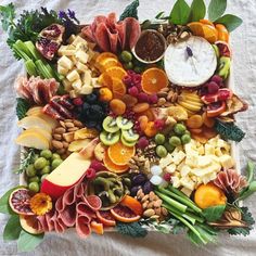 a platter filled with lots of different types of fruit and vegtables