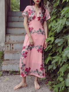 Maxi length V neck dress with short sleeve and pink floral print. Silky satin like material feel. Model is in MINUSEY S. * MINUSEY S = EU 34, US 2* MINUSEY M = EU 36, US 4* 100% Polyester* Dry clean* Made in Korea - Model Height: 170cm/5'7" (US2, EU34) Pink Printed V-neck Midi Dress, Pink Rose Print Midi Dress For Summer, Summer Pink Rose Print Midi Dress, Feminine Pink Printed Floral Dress, Feminine Pink Floral Printed Dress, Pink Floral V-neck Summer Dress, Feminine Pink Floral Print Midi Dress, Pink Floral Print V-neck Maxi Dress, Feminine Printed Short-sleeve Dresses