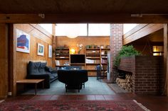 a living room filled with furniture and a fire place