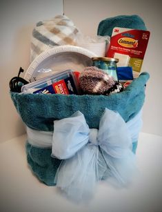 a blue bag filled with items sitting on top of a table