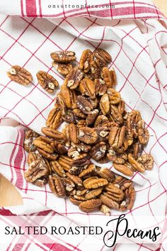 roasted pecans on a red and white checkered towel with text overlay that reads salted roasted pecans