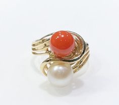 Aloha and welcome to our online store! For Sale: Brand New Genuine Natural Hawaiian Red Coral and Akoya Pearl 14k Yellow Gold Ring Coral is genuine untreated harvested from the Mid-Pacific Ocean Sphere shaped coral cabochon measures approximately:  7.88 mm in diameter Genuine natural Akoya pearl measures approximately 8.00 mm in diameter Solid 14 karat yellow gold Ring top width:  17.00 mm wide Ring bottom band width: 3.37 mm Ring size: 6.75 Total ring weight:  5.80 grams Ring can be resized-- p Coral Ring, Wide Ring, Etsy Gold Ring, Wide Rings, Akoya Pearls, Yellow Gold Ring, Pacific Ocean, Red Coral, Pearl Ring