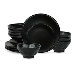 black dinnerware is stacked on top of each other