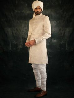 <p><strong>Sherwani:</strong><br />Color: Cornsilk<br />Fabric: Self Jamawar<br />Elegant sherwani features rich quality embellishments accent the front, collar and sleeves, and all over<br />Front button closure<br /><br /><strong>Inner:</strong><br />Comes with white kurta and churidar pajama<br /><br /><strong>Additional Accessories:</strong> <br /><strong>Jodhpuri/Saleem Shahi shoes:</strong> US$30 (Made with sherwani material & embroidery) <br /><strong>Tied pre-made Turban:</strong> US$150 Churidar Pajama, Sherwani For Groom, Wedding Turban, Nikah Ceremony, Indian Groom Wear, Sherwani Groom, Traditional Weddings, White Kurta, Indian Groom