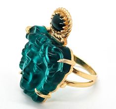 Tagliamonte Venetian Italian green glass malachite vermeil sterling silver ring. This piece is new and comes with the original stamped box, bag, polish cloth and insert from the company. Beautiful Venetian glass in the figure of Medusa. She wears a banded malachite accent. 18k gold over sterling silver setting. Stamped on the back of the ring Tagliamonte 925 Italy. Acid tests positive for sterling silver. Ring measures size 8 and 1/2. Luxury Green Collectible Jewelry, Handmade Luxury Emerald Ring, Luxury Green Intaglio Rings, Handmade Luxury Emerald Ring For Formal Occasions, Luxury Handmade Emerald Ring For Formal Occasions, Elegant Green Intaglio Ring, Formal Malachite Gemstone Rings, Green Intaglio Ring Jewelry, Yellow Gold Malachite Ring Gift