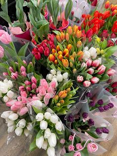 a bouquet of tulips and other flowers on a table