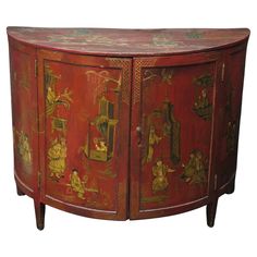 a red painted cabinet with figures on it