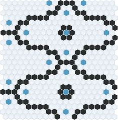 a black and blue pattern on a white tile wall with hexagon tiles in the shape of a soccer ball