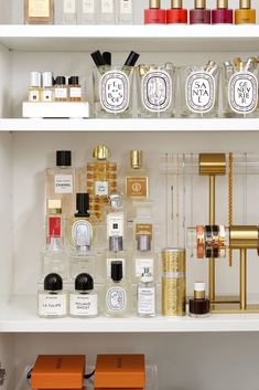 the shelves are filled with different types of perfumes