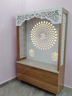 a white and wooden cabinet with an ombrephant cut out on the front