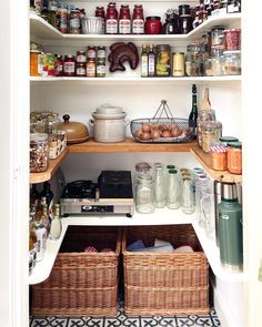 an organized pantry with baskets and food items