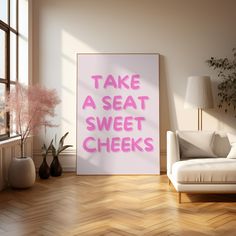 there is a pink sign that says take a seat, sweet cheeks on the wall