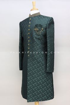 Update your ethnic wardrobe with this exquisite dark green silk Indo-western piece. Embellished with intricate embroidery, and weaving work,followed by appealing pattern. this garment showcases a contrasting collar, full placket, Hook, and button opening. Accompanied by contrasting pants. Designer Green Kurta With Embroidered Border, Elegant Green Kurta With Embroidered Border, Designer Green Embroidered Kurta, Designer Green Kurta For Festive Occasions, Green Bandhgala With Traditional Drape, Green Long Sleeve Sherwani For Transitional Season, Green Long Sleeve Designer Sherwani, Green Designer Wear Sets, Elegant Green Set With Embroidered Border