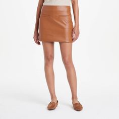 Transform any look into an on-trend statement of bold and edgy style with this Faux-Leather Mini Fashion Skirt from A New Day™. This classic-rise skirt is tailored in a regular fit with a flattering mini-length silhouette. It sports a side zipper closure and skimming darts on the back, along with welt pockets on the front for functional aesthetic. Plus, the fashion skirt is made of extra-lightweight faux leather with full lining and is machine washable for added convenience. A New Day™: Style th Camel Leather Skirt Outfit, Tan Leather Skirt, Functional Aesthetic, Midi Sweater Skirt, Brown Leather Skirt, Leather Skirt Outfit, Faux Leather Midi Skirt, Faux Leather Mini Skirt, Leather Mini Skirt