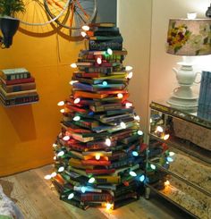 a small christmas tree made out of books