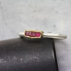 My newest stackable ring features a lovely rectangular raw ruby crystal in a deep red color. Set in rich yellow gold atop a brushed silver band to bring out contrast. I fabricated this simple design from sterling silver and 22k yellow gold. The rough gemstone is all natural and displays darkness and light. Weight: 0.55ct Measurement: 6.5x3mm Ring shank measures 2x2mm. Size 5.5 or 50.5 or 16 or K 1/2 nangijalajewelry.etsy.com One Of A Kind Hand Forged Ruby Ring In Red, Hand Forged Red Ruby Ring, Rectangular Ruby Ring Gift, Rectangular Ruby Ring For Gift, Ring Simple Silver, Raw Ruby, Ring Shank, Ruby Crystal, Ring Simple