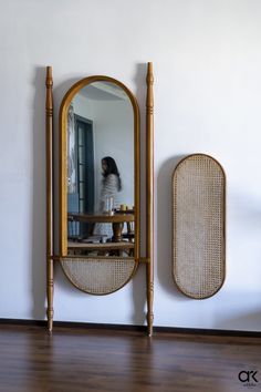 a mirror sitting on top of a wooden table