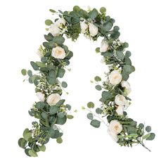 the letter o is made up of white flowers and greenery with green leaves on it