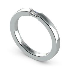 a white gold ring with a single diamond in the center and an inscription on the side