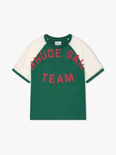 Premium tee crafted from soft, lightweight fabric. Rhude Sail Team jersey graphic showcased on the front. Features a comfortable and relaxed custom Rhude fit. The stripe design on the sleeves adds a sporty touch to this classic short sleeve.   100% COTTON JERSEY DRY CLEAN ONLY WE RECOMMEND TAKING YOUR STANDARD SIZE Sporty Relaxed Fit Cotton Jersey T-shirt, Athleisure Jersey T-shirt With Letter Print, Green Crew Neck T-shirt With Letter Print, Green Athleisure Tops With Three Stripes Branding, Green Sporty T-shirt With Relaxed Fit, Sporty Crew Neck T-shirt With Letter Print, Green Jersey T-shirt With Letter Print, Sportswear Cotton T-shirt With Graphic Print, Graphic Cotton T-shirt For Sportswear